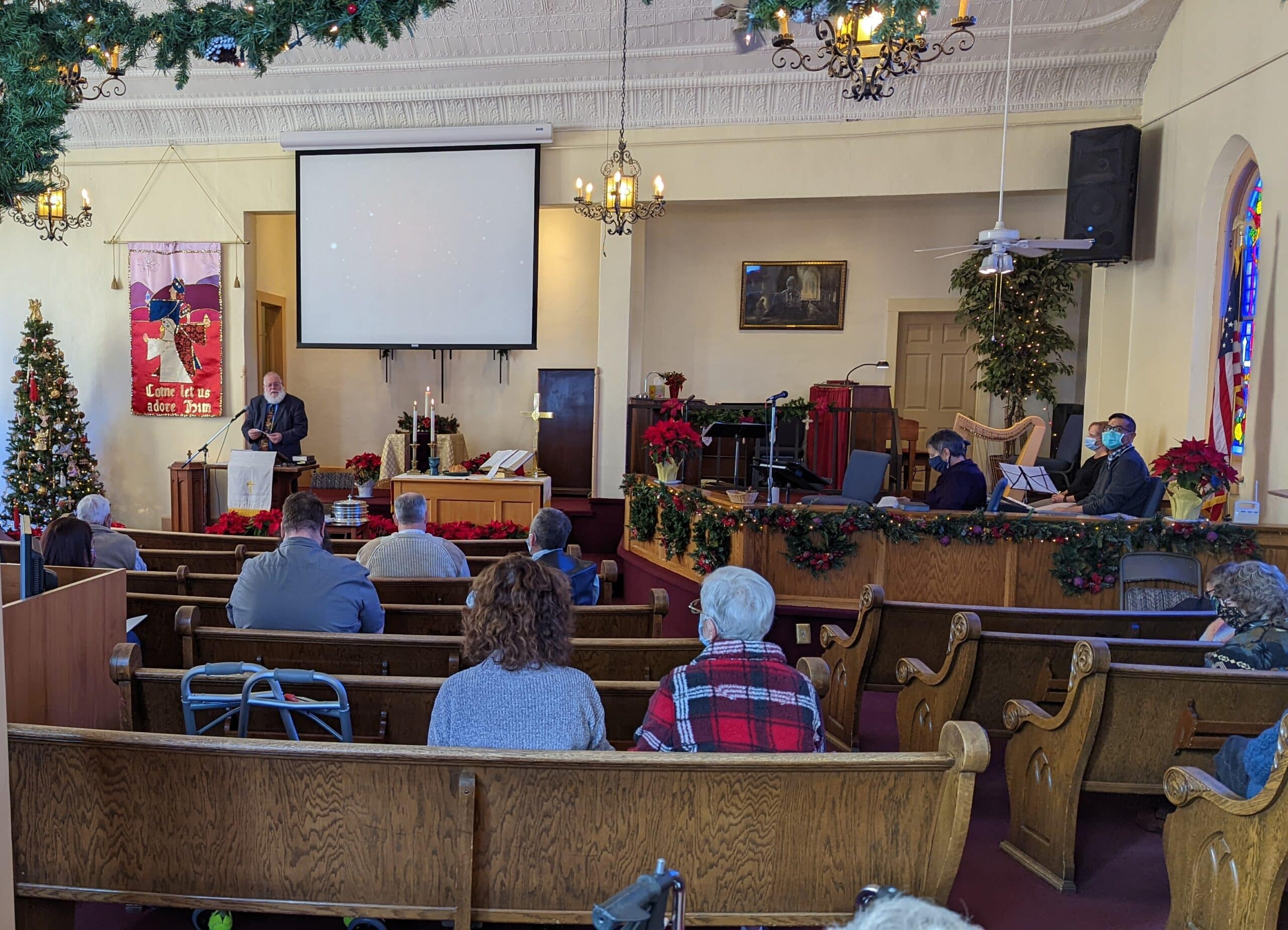 The sanctuary decorated for Christmas during worship