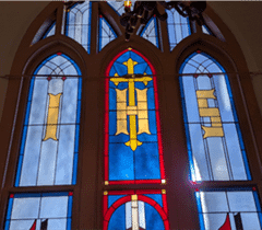Stained glass with the IHS Christogram